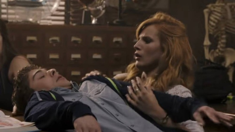 Max (Ryan Ochoa) falling over Cammie (Bella Thorne)  in Mostly Ghostly: Have You Met My Ghoulfriend?