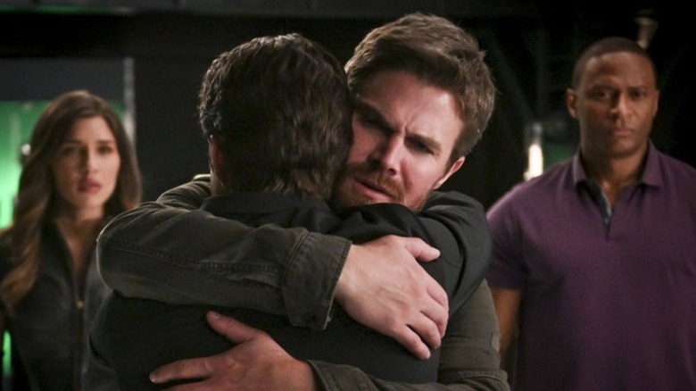 Arrow's Oliver hugs William