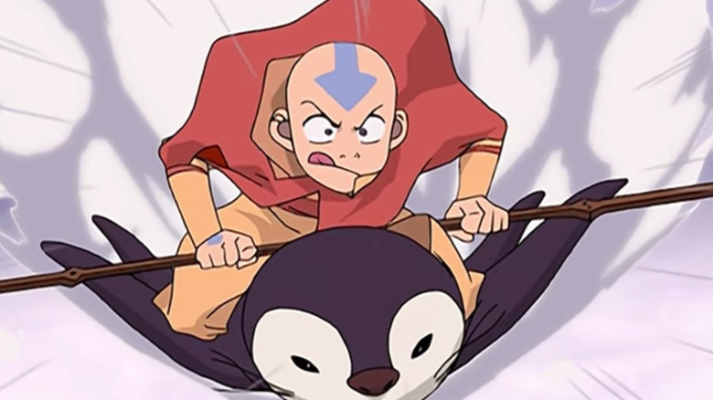 Aang doing penguin sledding in Avatar: The Last Airbender