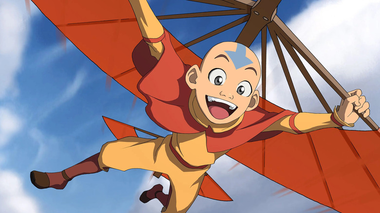 Aang soars with his Airbending glider in Avatar: The Last Airbender