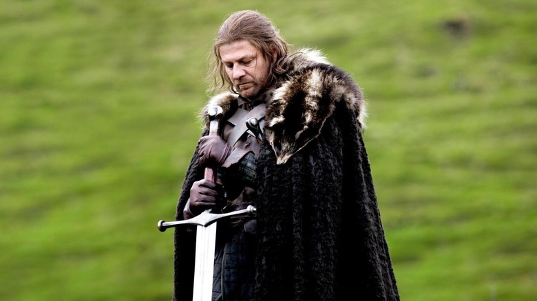 Ned Stark holding sword looking down Game of Thrones