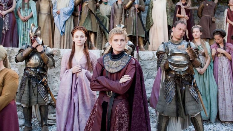 Joffrey crossing arms Sansa in background Game of Thrones