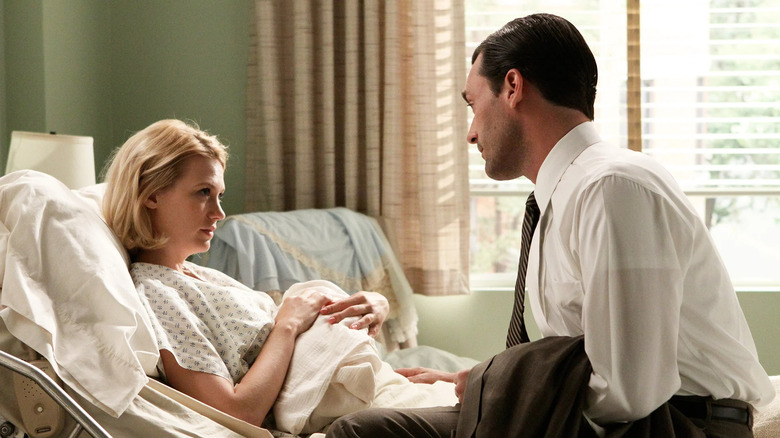 Don sits with Betty in hospital