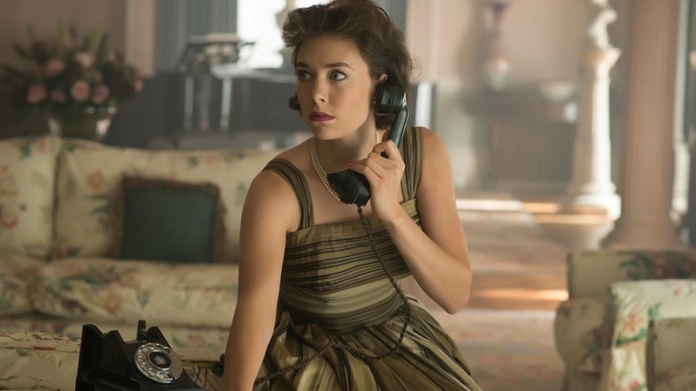 Vanessa Kirby's Princess Margaret looks concerned while on the telephone in The Crown