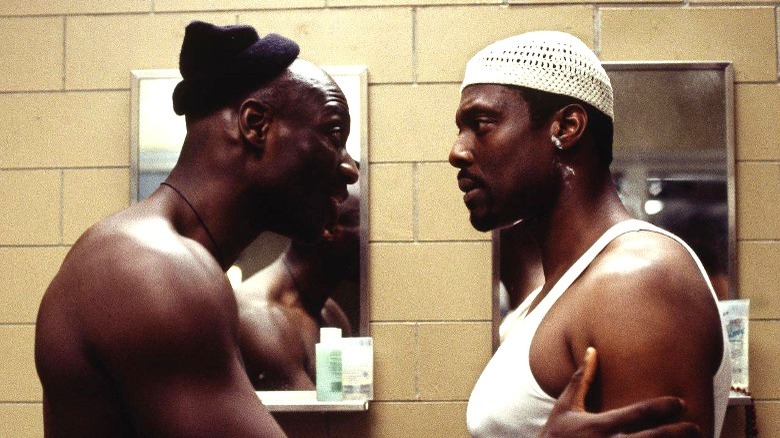 Simon Adebisi and Kareem Saïd talking in a washroom