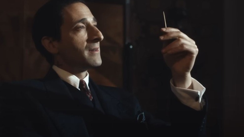 Adrien Brody's Luca Changretta holding a toothpick on Peaky Blinders