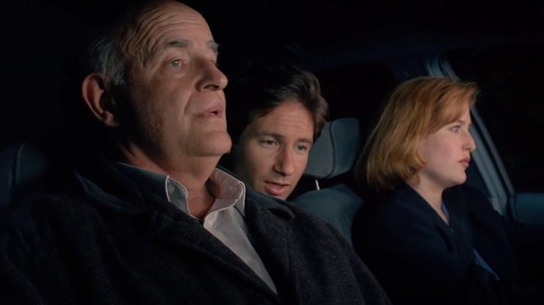 Clyde Bruckman with Mulder and Scully