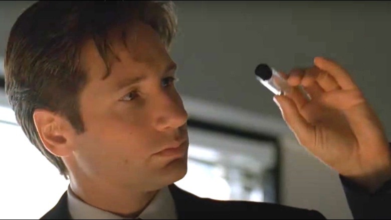 Mulder examining test tube