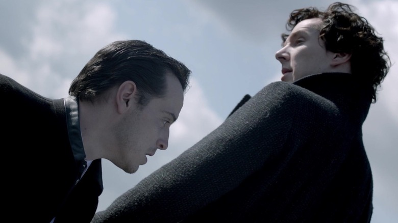 Sherlock standing over Moriarty