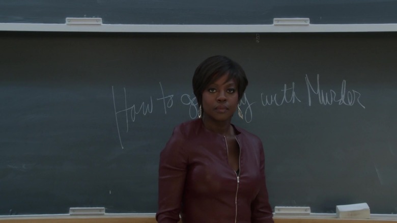 Annalise Keating standing in front of whiteboard that reads "How to get away with murder"