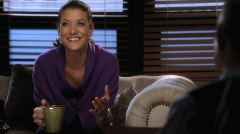 Kate Walsh holding mug and smiling in Private Practice