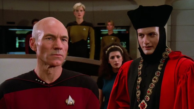 Q (John de Lancie) taunts Picard (Patrick Stewart) on the bridge in Star Trek: The Next Generation