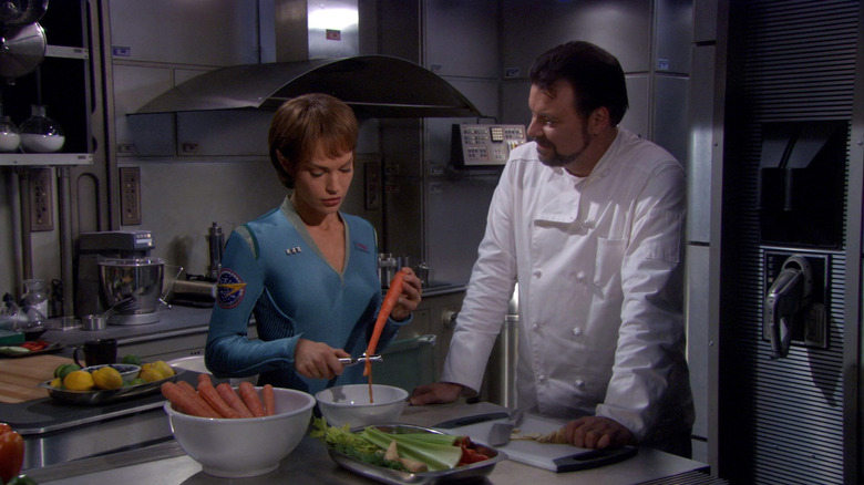 Will Riker (Jonathan Frakes) watches T'Pol (Jolene Blalock) peel carrots in Star Trek: Enterprise