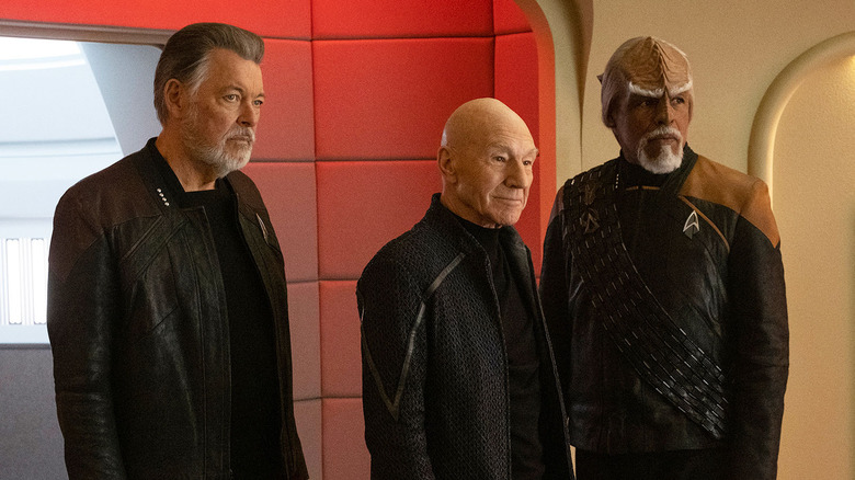 Will Riker (Jonathan Frakes), Jean-Luc Picard (Patrick Stewart), and Worf (Michael Dorn) stand on the bridge in Star Trek: Picard