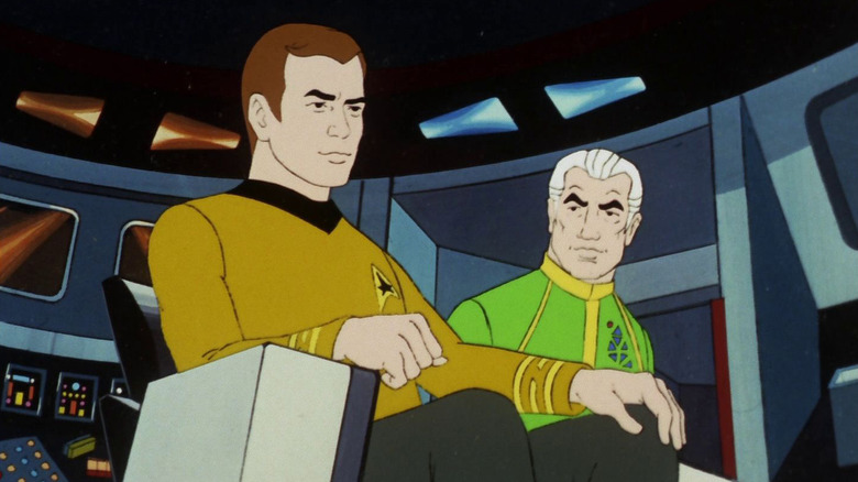 Robert April (James Doohan) watches Jim Kirk (William Shatner) in the captain's chair in Star Trek: The Animated Series