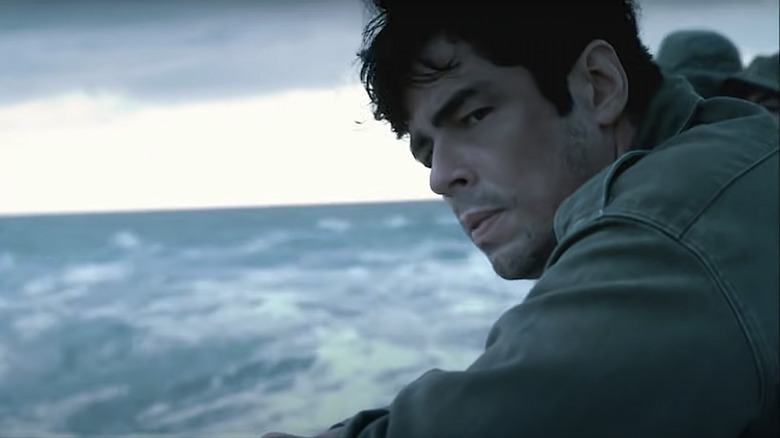 Benicio Del Toro in Che sits by ocean