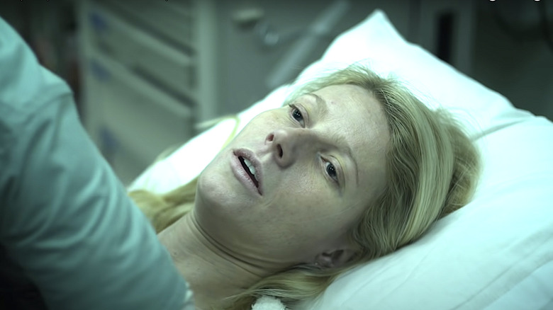 Gwenyth Paltrow in Contagion lies on bed