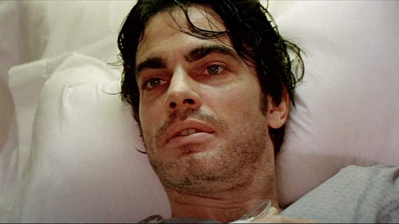 Peter Gallagher lies in bed in The Underneath