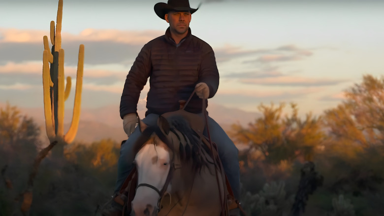 A contestant riding a horse on The Last Cowboy