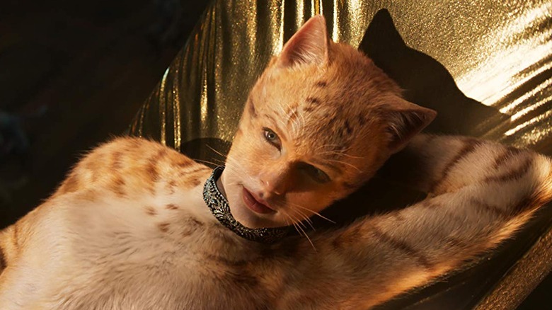 Taylor Swift as Bombalurina reclining on a moon in Cats (2019)