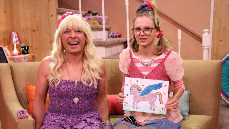 Jimmy Fallon as Sara smiling with Taylor Swift as Natalie holding a pegacorn drawing on The Tonight Show (2014)