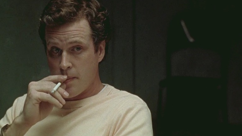 cary elwes as ted bundy smokes cigarette