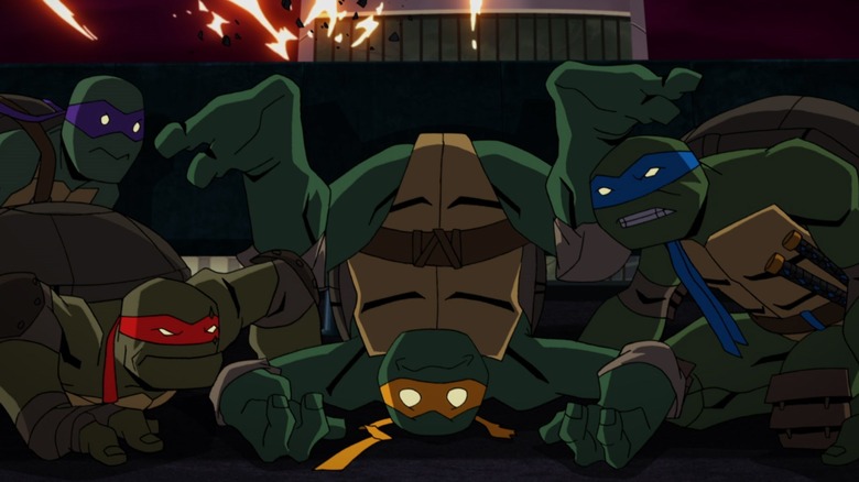 TMNT hiding behind an exploding building