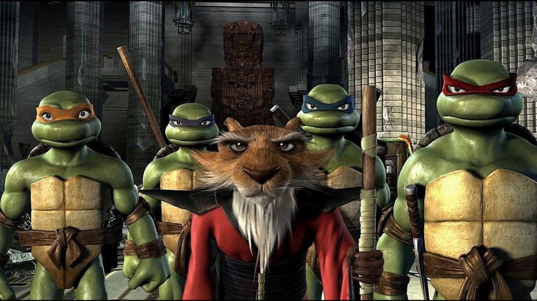 The Ninja Turtles and Splinter stand in a line