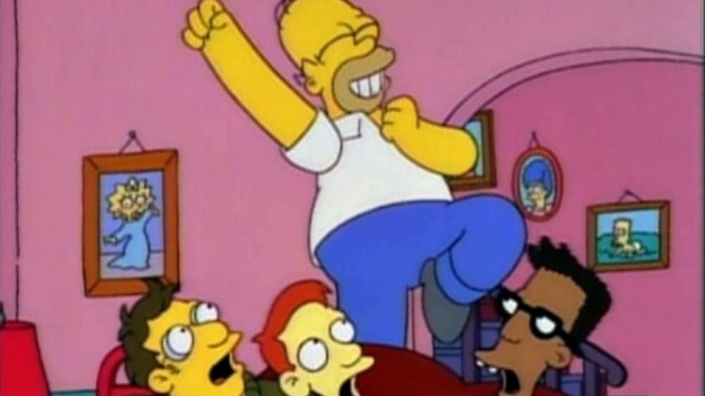 Homer jumps and celebrates in front of the nerds in The Simpsons