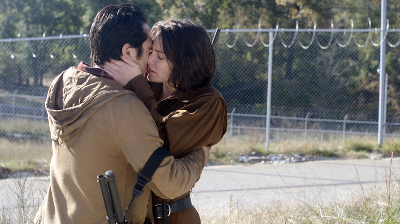 Maggie and Glenn kiss