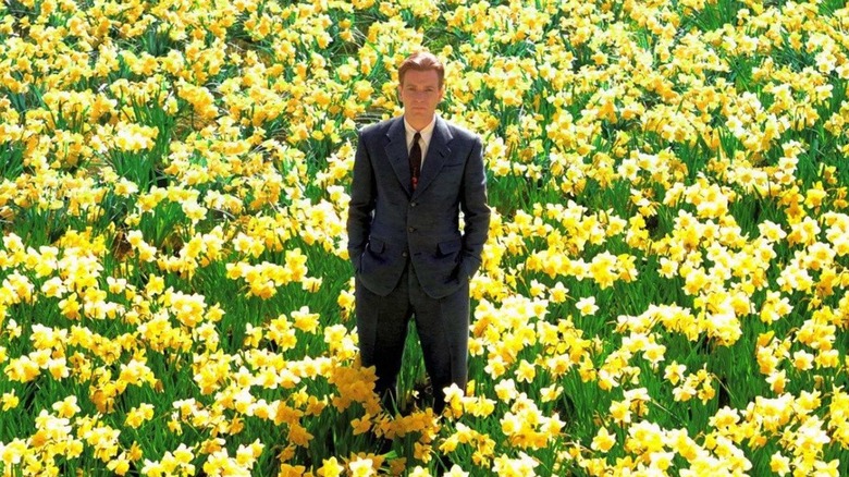 Ed Bloom standing in field of flowers