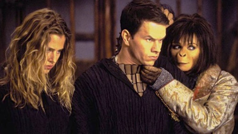 Ape woman cradles Mark Wahlberg's head