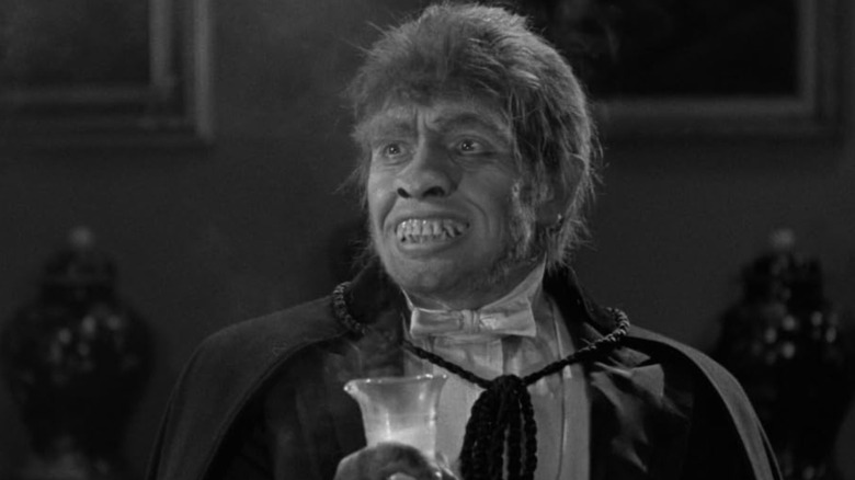 Fredric March is in full Mr. Hyde mode, grinning with his monstrous teeth in Dr. Jekyll and Mr. Hyde