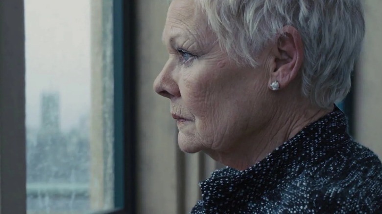 Judi Dench's M looks out a window in Skyfall