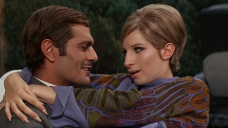 Barbara Streisand's Fanny wraps her arms around Omar Sharif's Nicky in Funny Girl