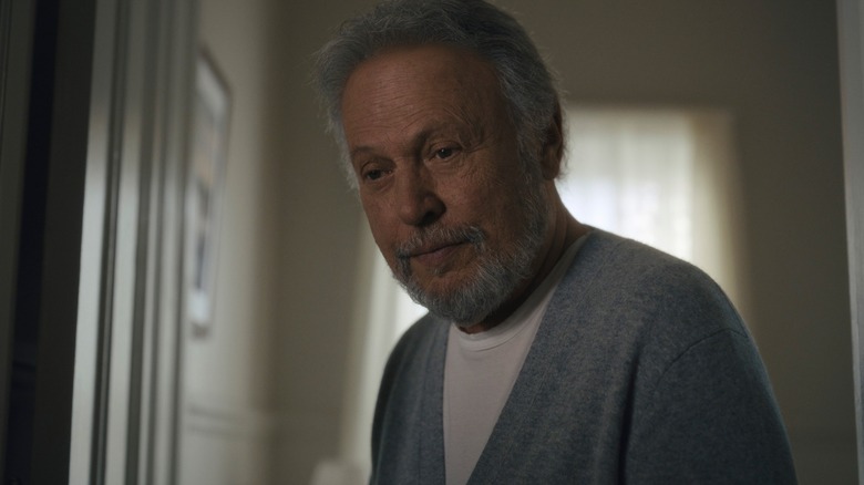 Billy Crystal's Eli looks warmly at someone offscreen in Before