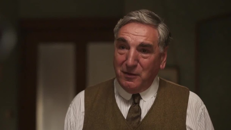 Jim Carter addressing Michelle Dockery in Downton Abbey 