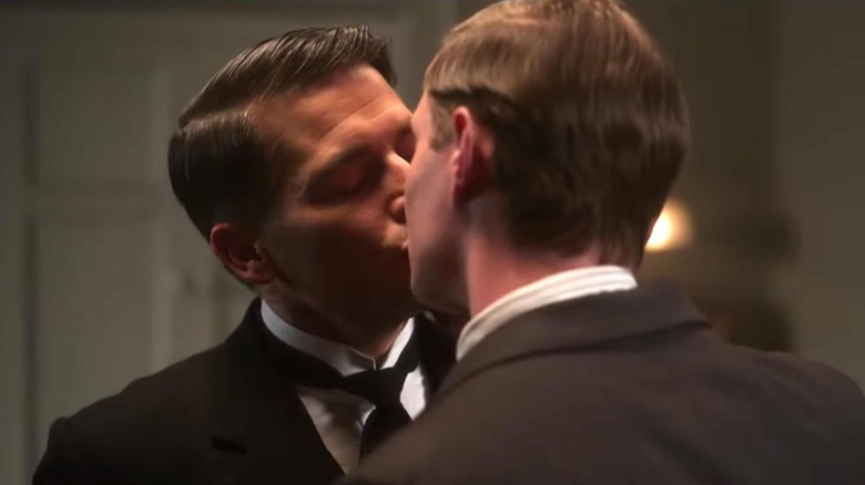 Rob James-Collier and Max Brown sharing a kiss in Downton Abbey 