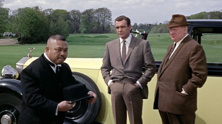Goldfinger bond and goldfinger watch oddjob on golf course