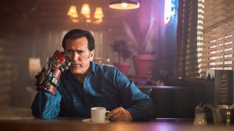 Ash sitting at a bar drinking coffee forlornly in Ash vs. Evil Dead