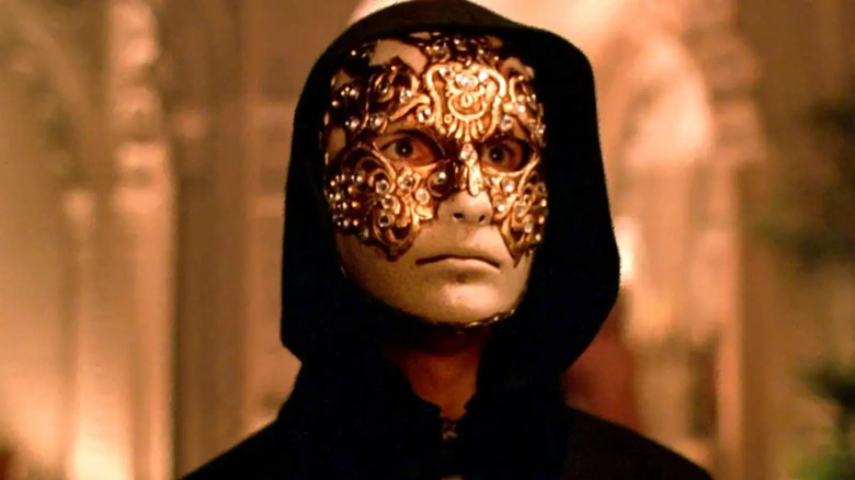 Tom Cruise wearing a gold mask as Bill Harford in Eyes Wide Shut (1999)