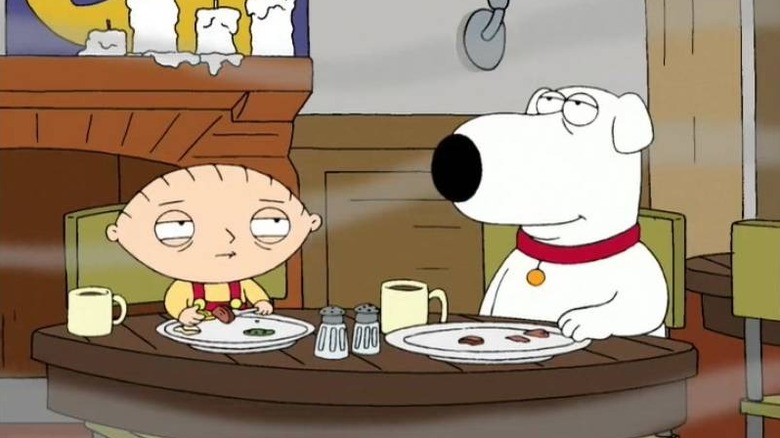 Brian and Stewie surrounded by smoke in a cafe in Family Guy's Road to Europe