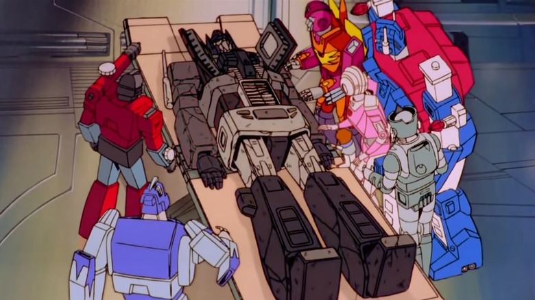 Optimus Prime on the table dead in Transformers: The Movie