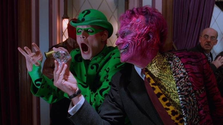 Batman Forever Riddler examines a diamond held by Two-Face