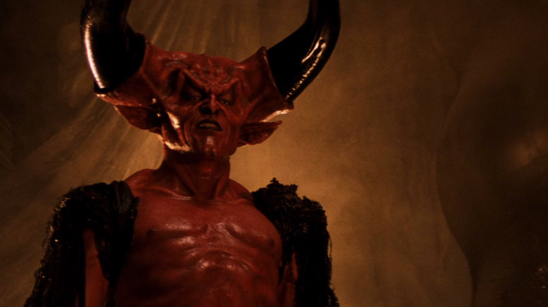 A red skinned devil with enormous black horns