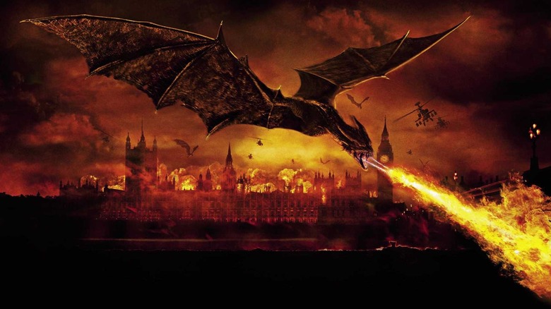 A flying dragon breathing fire on London