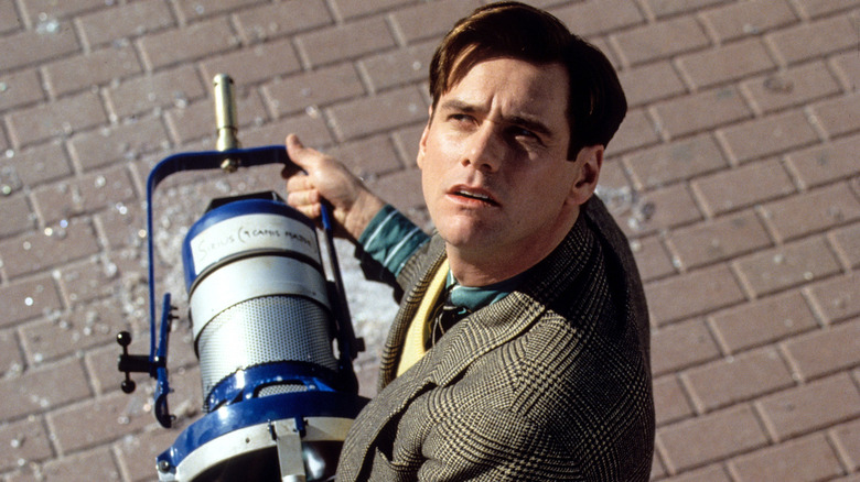 Jim Carrey holding light The Truman Show