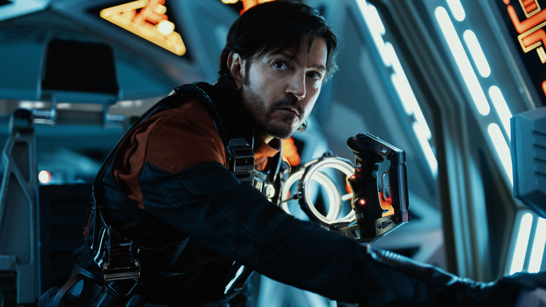 Diego Luna as Cassian Andor at the controls of a spaceship in Andor season 2