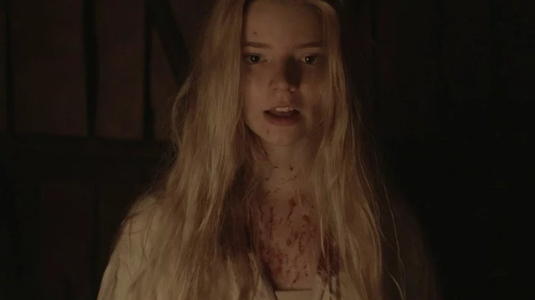 Anna Taylor-Joy's Thomasin is covered in blood in The Witch.