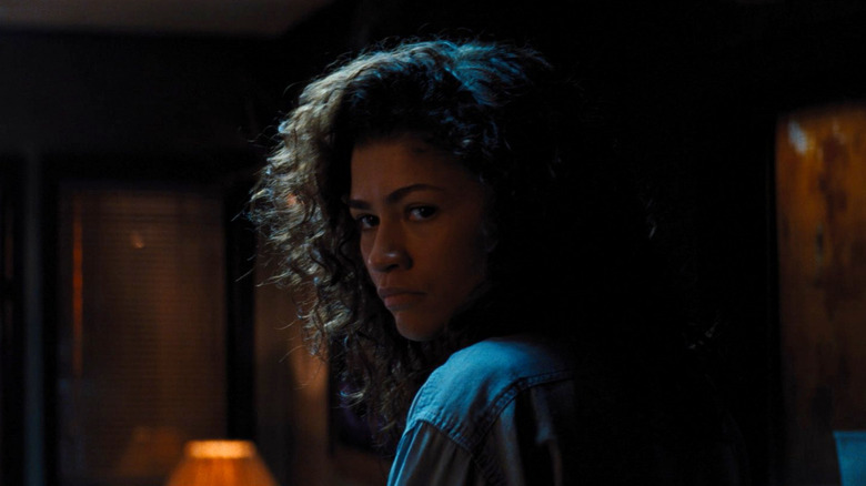 Euphoria season 3 still, Rue looking at someone in a dark room